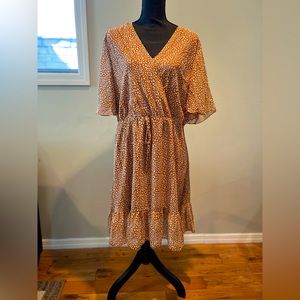 Tan and white print. Classic style